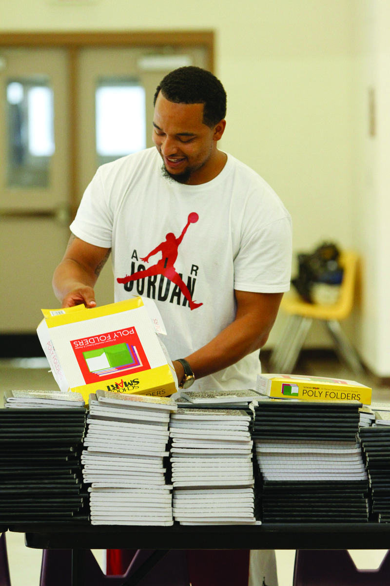 Kevin Payne prepares supplies for donations to the students of Junction City Elementary School. The Kevin Payne Foundation donated supplies for the 2017-18 school year.