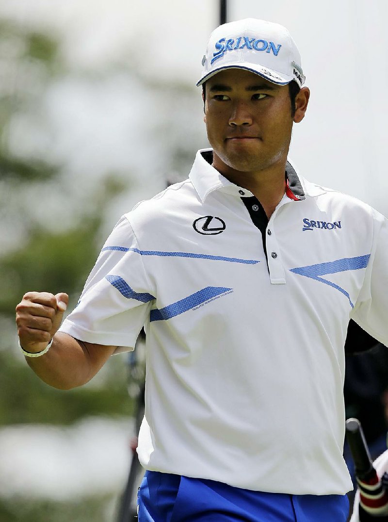 Hideki Matsuyama, from Japan, pumps his fist after making eagle on the second green during the final round of the Bridgestone Invitational golf tournament at Firestone Country Club, Sunday, Aug. 6, 2017, in Akron, Ohio. 