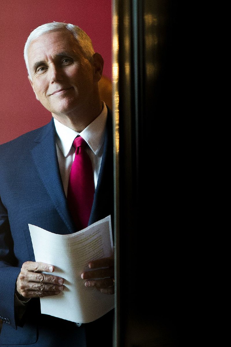 Vice President Mike Pence waits for President Donald Trump to speak on the health care law at an event on July 24 at the White House. 
