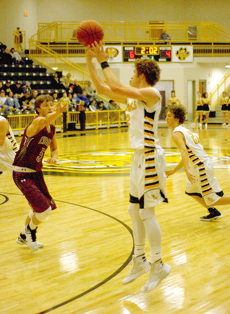 MARK HUMPHREY ENTERPRISE-LEADER Prairie Grove&#8217;s Isaac Disney, shown taking a jump-shot in a 51-38 Jan. 11 victory over Lincoln, earned All-Conference basketball honors and was named to the KURM Dream Team despite playing with an injury. Disney signed with Arkansas Tech on a football scholarship.
