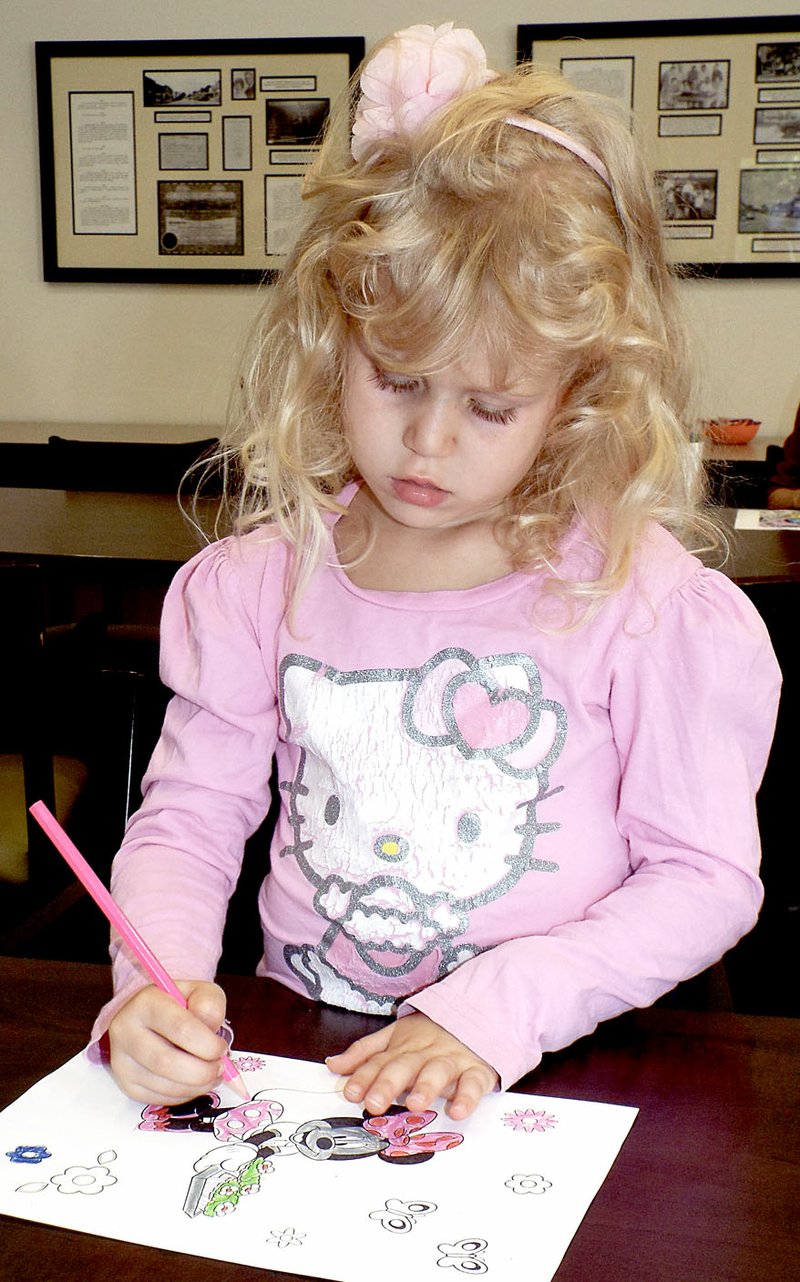Photo by Randy Moll Abbi Felten, 5, worked on a coloring page at the Gentry Public Library August 2. She was taking part in the National Coloring Book Day observance at the library in Gentry. Gentry was one of only a few libraries in Arkansas to observe the day.