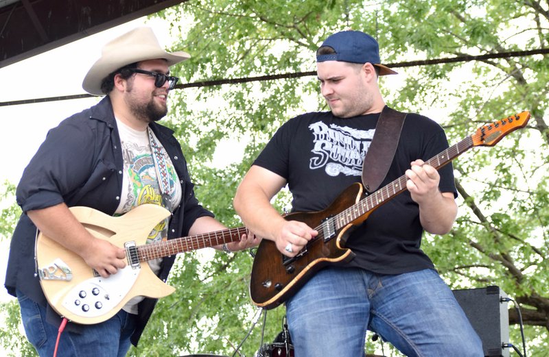 Photo by Mike Eckels Carter Beggs (left) and Cole Reeves played a guitar duet during the 64th Annual Decatur Barbecue at Veterans Park in Decatur Aug. 5. Beggs and Reeves first performed together on the same stage during the 2010 Barbecue concert as the Bobbycolecarter band.