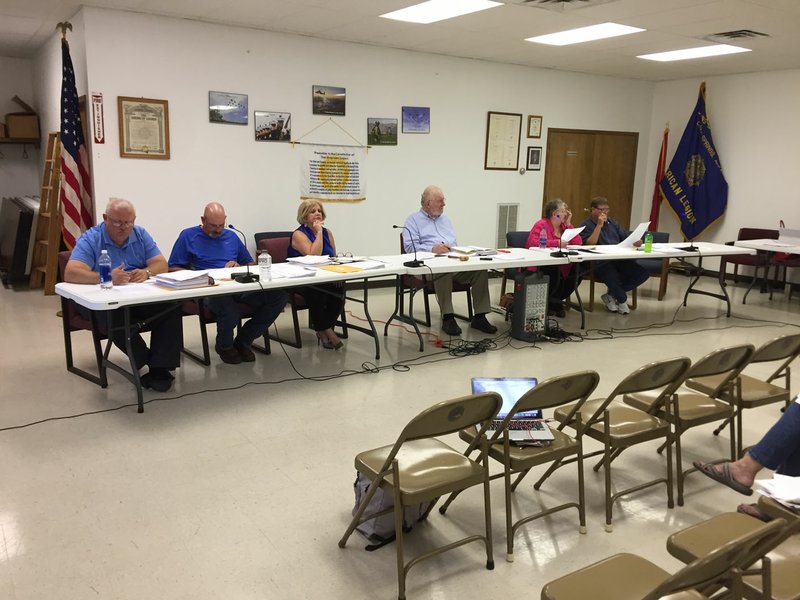 NWA Democrat-Gazette/ALEX NICOLL The Cave Springs City Council listens to city attorney Justin Eichmann as he explains what the city&#8217;s next step should be in ensuring the mistakes made in regards to the city&#8217;s use of funds will not happen again.