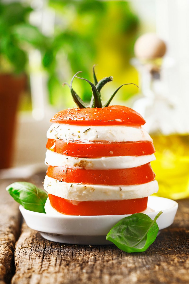 Stacking tomato and mozzarella like this offers a new approach to Caprese salad.