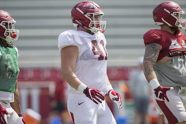Arkansas defensive tackle Austin Capps (41) goes through practice Saturday, April 8, 2017, in Fayetteville. 