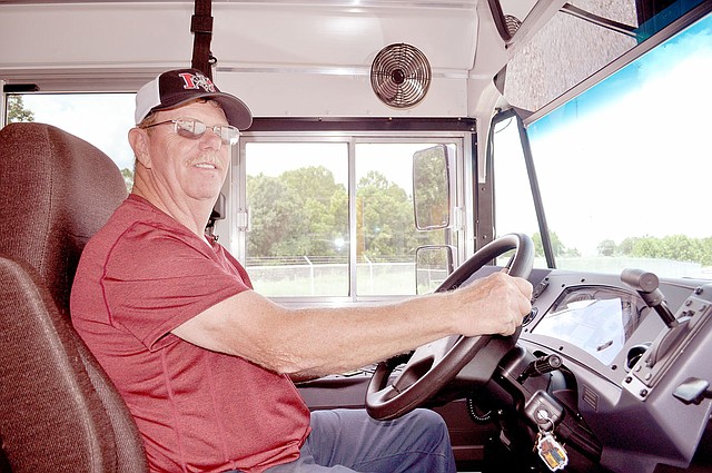 RACHEL DICKERSON/MCDONALD COUNTY PRESS McDonald County R-1 School District Transportation Director Clyde Davidson is pictured on a bus. Safety is the transportation department&#8217;s highest priority, Davidson said.