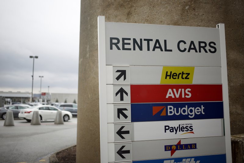 Signs directs travelers towards rental car company locations inside the Louisville International Airport in Louisville, Kentucky, on Feb. 28, 2017. Bloomberg photo by Luke Sharrett.
