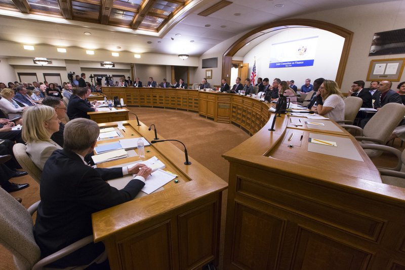 The Assembly Committee on Jobs and Economy meets about the incentive deal for Taiwan-based Foxconn Technology Group, Thursday, Aug. 3, 2017, at the state Capitol in Madison, Wis. The company last week that it planned to construct the first liquid crystal display panel factory outside of Asia in southeast Wisconsin. The deal requires the state to approve $3 billion in tax breaks tied to Foxconn hiring and spending as promised. (Mark Hoffman/Milwaukee Journal-Sentinel via AP)