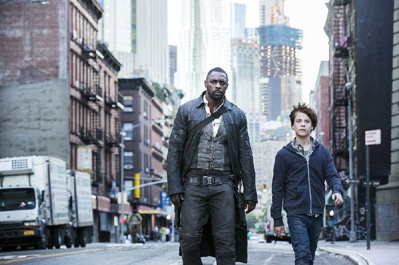 Idris Elba (left) and Tom Taylor star as Roland and Jake in Columbia Pictures’ The Dark Tower. It came in first at last weekend’s box office and made about $19.1 million.