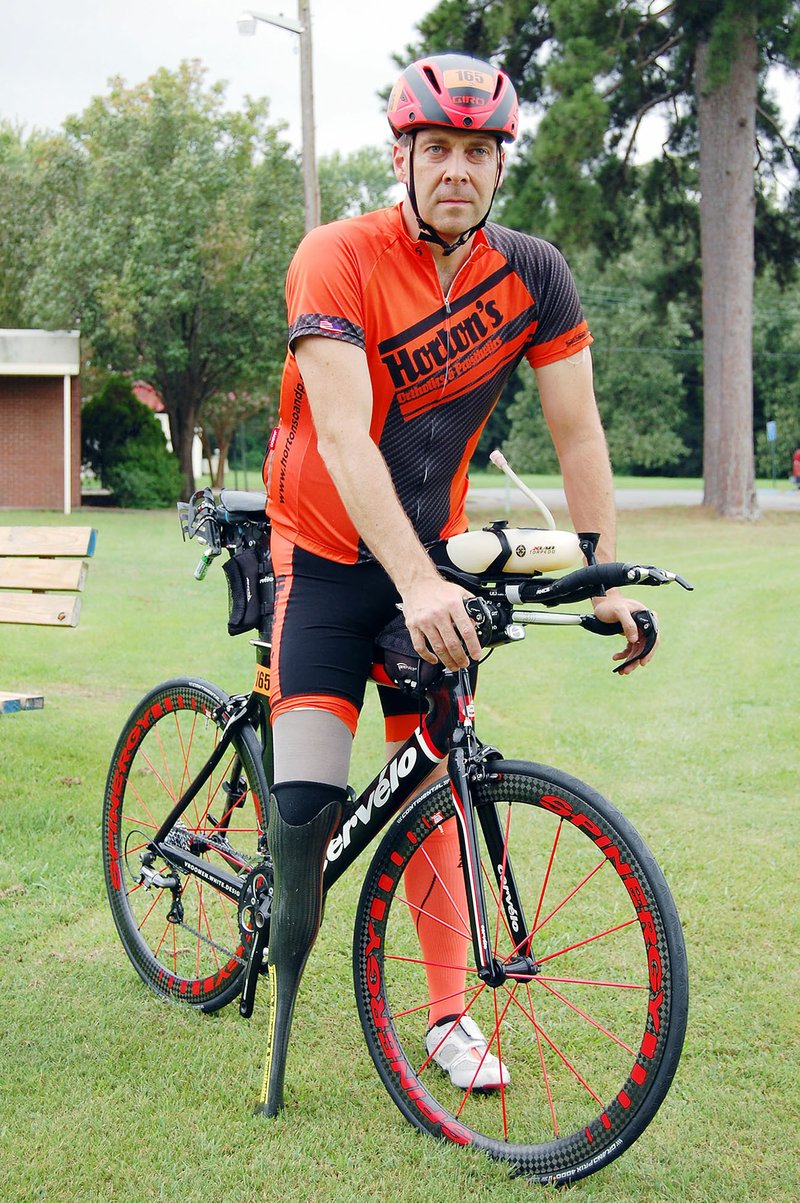 Chris Madison, a staff attorney for the city of Bryant, finished the Alaskaman Extreme Triathlon on July 15 — 10 days before the 32nd anniversary of when he lost his leg in a boating accident.