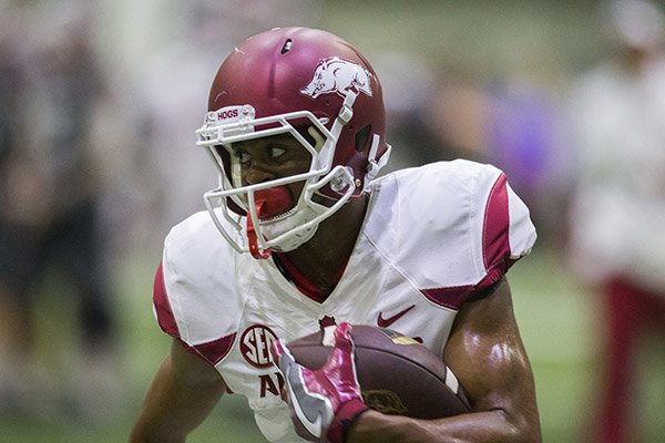 Arkansas receiver Jonathan Nance runs after the catch during a practice Saturday, April 29, 2017, in Fayetteville. 