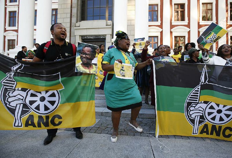 African National Congress supporters celebrated Tuesday outside parliament in Cape Town, South Africa, after President Jacob Zuma survived a no-confidence vote. 
