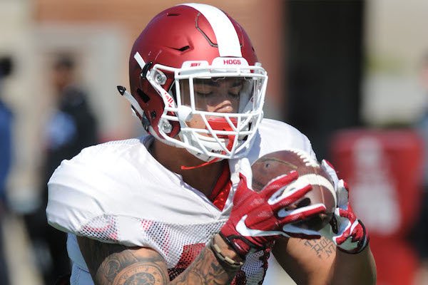 Arkansas linebacker Kyrei Fisher takes part in a drill Saturday, April 1, 2017, during practice at the university practice field in Fayetteville. 