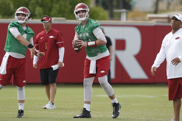 Ty Storey (left) and Cole Kelley work during Arkansas football practice Friday, July 28, 2017.