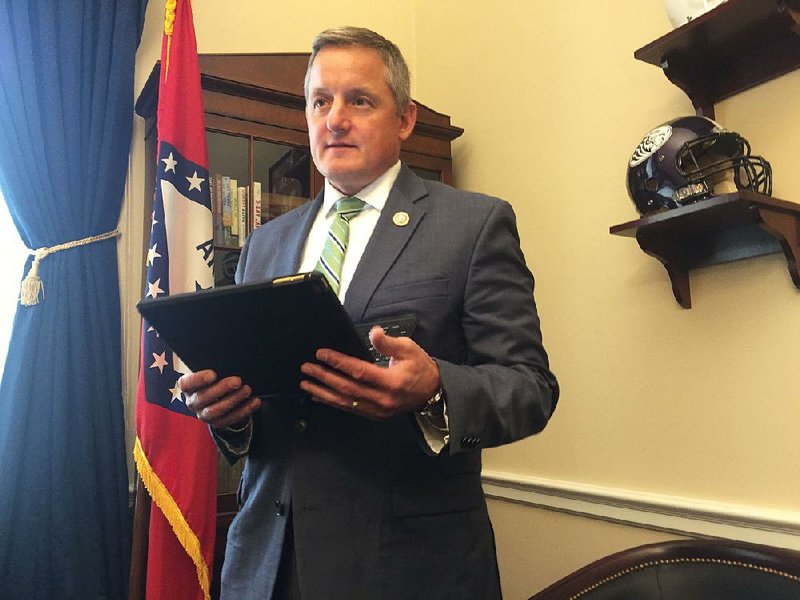 In his Capitol Hill office, Congressman Bruce Westerman, R-Ark., prepares to answer questions online Tuesday, April 25 2017. 