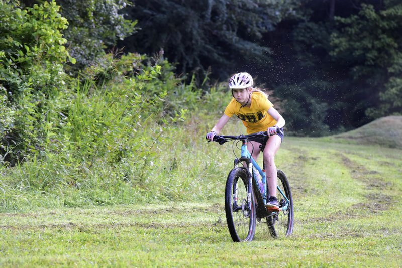 NWA Democrat Gazette/SPENCER TIREY Cate Mertins of Haas Hall Academy practices with her NICA mountain biking team Thursday, July 13, 2017, at Slaughter Pen mountain biking trail in Bentonville.  Mountain biking has exploded in Northwest Arkansas as well as across the state. More than 20 NICA teams, including a host of single-school teams, across the state will compete in the second year of the program.