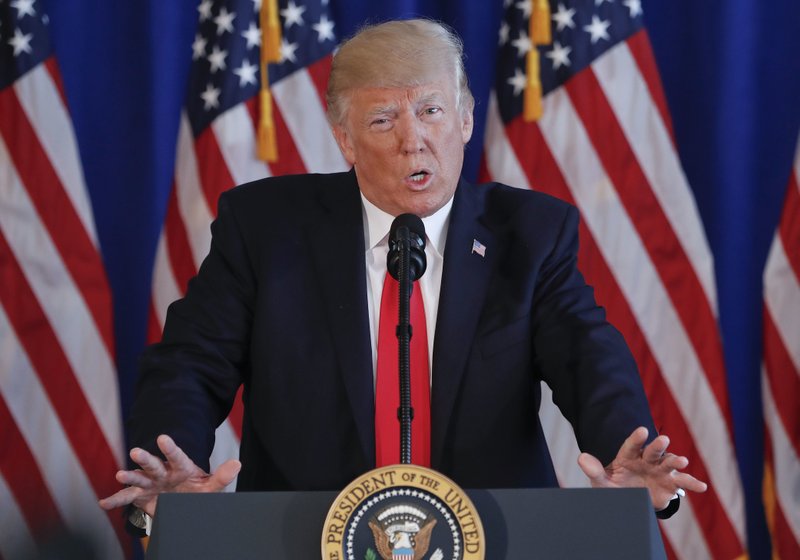 President Donald Trump speaks about the ongoing situation in Charlottesville, Va., at Trump National Golf Club, Saturday, Aug. 12, 2017, in Bedminster, N.J. 