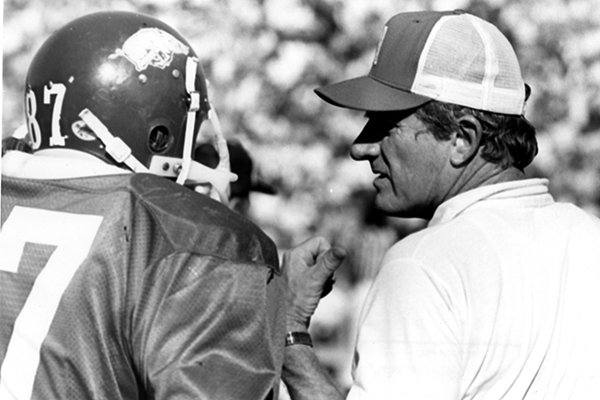 Arkansas coach Frank Broyles talks to a player during an unidentified home game in 1973. 