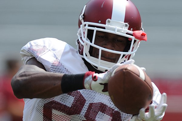 Arkansas defensive back Josh Liddell makes a catch Saturday, Aug. 5, 2017, prior to the start of a scrimmage in Razorback Stadium in Fayetteville. 