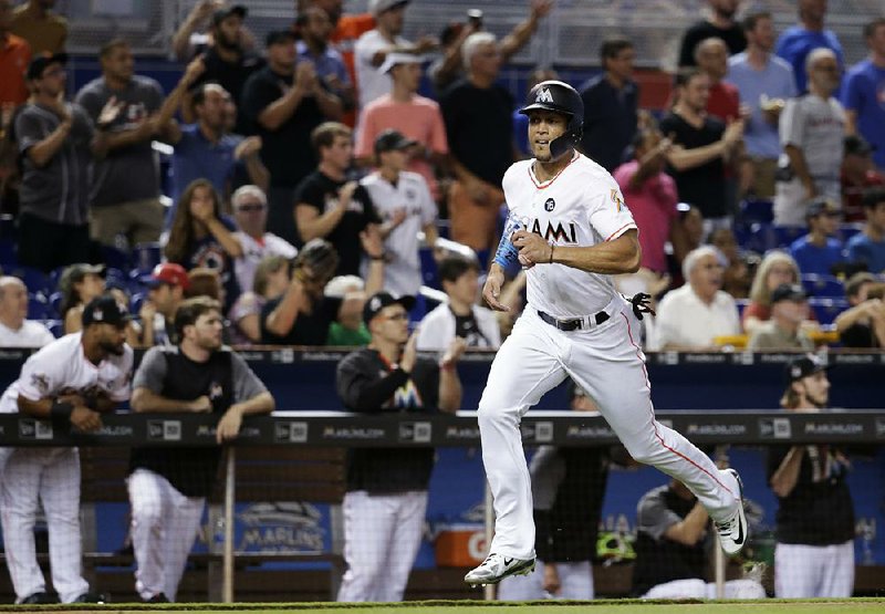 Miami Marlins slugger Giancarlo Stanton cleared revocable waivers Tuesday, according to a report from Yahoo Sports, making him eligible to be traded to any team.