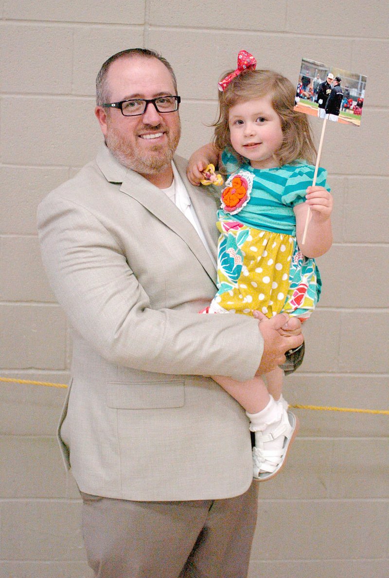 MARK HUMPHREY ENTERPRISE-LEADER Prairie Grove baseball coach Chris Mileham poses with his daughter, Lanie, 3; during a recent baseball awards banquet.