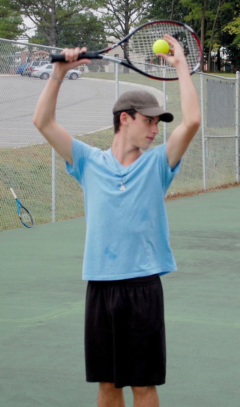 Graham Thomas/Herald-Leader Siloam Springs tennis player Avery Lang prepares to serve during practice on Aug. 7.