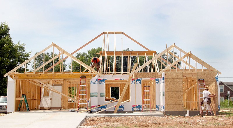 LYNN KUTTER ENTERPRISE-LEADER This house in Sundowner Estates is one of many houses under construction in Prairie Grove. The city expects to break a record for the second consecutive year for the number of permits issued for single-family houses.