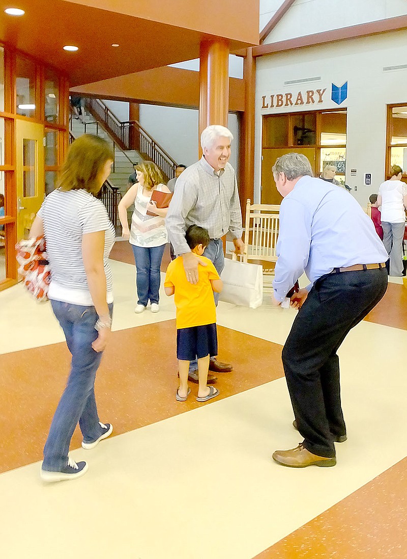 Lynn Atkins/The Weekly Vista Principal Chad Mims tries to welcome first-grader Jacob Guerra to Cooper Elementary School during the annual Back To School Open House last week. Guerra was attending with his grandparents, Rosie and Jim Cheeks. The school year started on Monday.