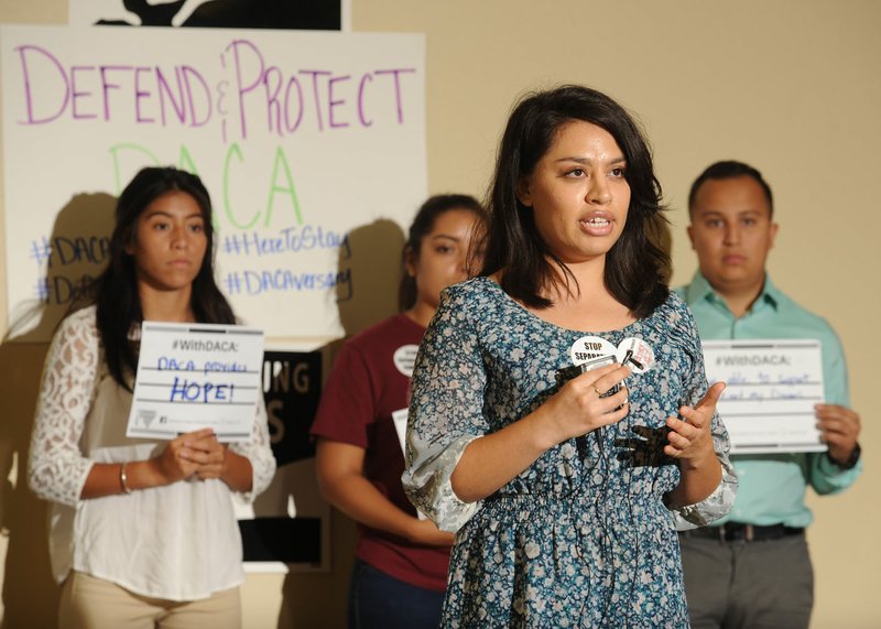 Mayra Esquivel, immigrant integration director for the Arkansas United Community Coalition, speaks Tuesday alongside other Deferred Action for Childhood Arrivals recipients during a news conference at the Northwest Arkansas Immigrant Resource Center in Springdale. The Arkansas United Community Coalition is spearheading an effort to persuade Arkansas Attorney General Leslie Rutledge not to work to cancel the DACA program.