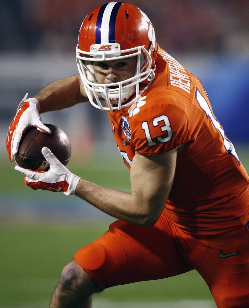 FILE - In this Dec. 31, 2016, file photo, Clemson wide receiver Hunter Renfrow (13) runs with the ball during the Fiesta Bowl NCAA college football game against Ohio State, in Glendale, Ariz. Renfrow, whose TD catch led to a national title, is already a folk-hero for Tiger fans. Now, he'd like to be a regular contributor and main cog of the offense. (AP Photo/Rick Scuteri, File)
