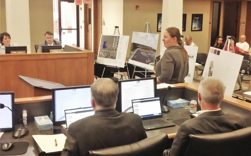 NWA Democrat-Gazette/DAVE PEROZEK Michelle McClaflin, a vice president with the architectural firm Hight Jackson Associates, presents plans Tuesday for elementary school No. 16 during the Rogers School Board meeting.