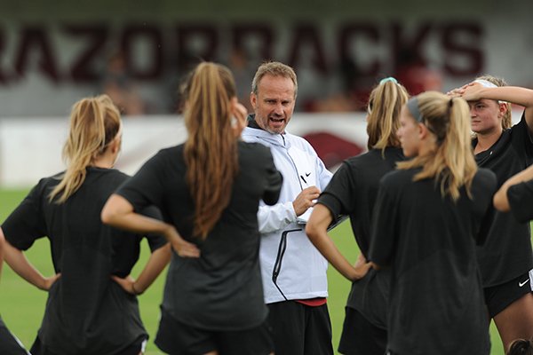 Arkansas soccer coach Colby Hale speaks Wednesday, Aug. 16, 2017, to members of his team at Razorback Field in Fayetteville.