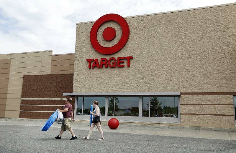 Customers exit a Target store in Methuen, Mass. in June, 2016. The Minneapolis-based retailer on Wednesday reported a quarterly profit of $673 million.