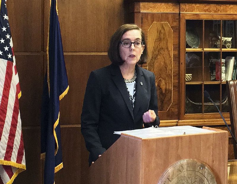 In this April 27, 2017, file photo, Oregon Gov. Kate Brown speaks in the Capitol ceremonial office in Salem, Ore. 