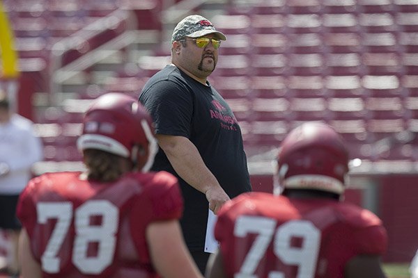 Arkansas offensive line coach Kurt Anderson watches warmups during practice Saturday, April 8, 2017, in Fayetteville.	