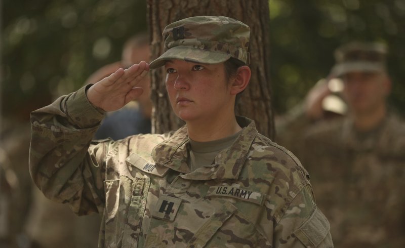 In this Saturday, July 15, 2017file photo, A U.S. soldier salutes during a change of command ceremony at Resolute Support headquarters, in Kabul, Afghanistan.