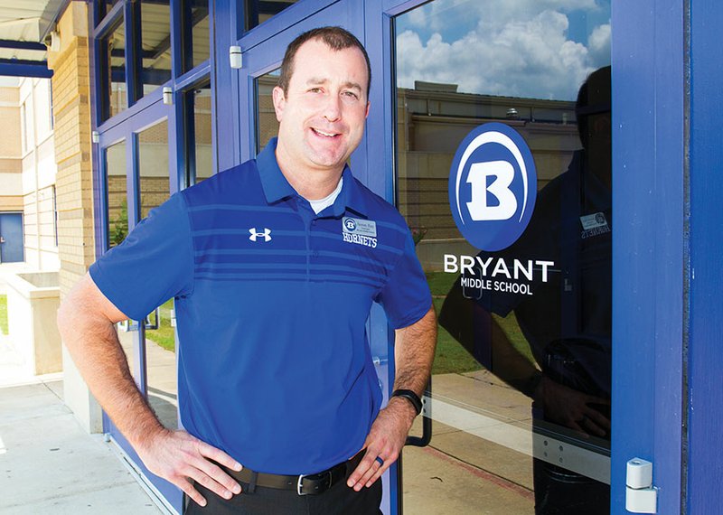 New Bryant Middle School principal Jason Hay stands outside the front of the building prior to the start of the 2017-18 school year. The Bryant School District is the only district where Hay has worked in his education career, starting as a special-education teacher and coach in January 2000.