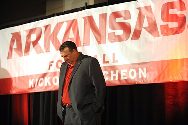 Arkansas coach Bret Bielema joins others in a moment of silence Friday, Aug. 18, 2017, for former coach and athletics director Frank Broyles, who died Monday, during the Kickoff Luncheon at the Northwest Arkansas Convention Center in Springdale.
