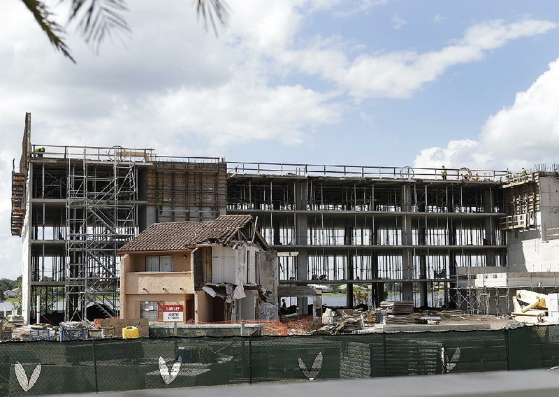 The Westgate Resorts time share complex was still under construction near Julieta Corredor’s damaged vacation condo in Orlando, Fla., in October.
