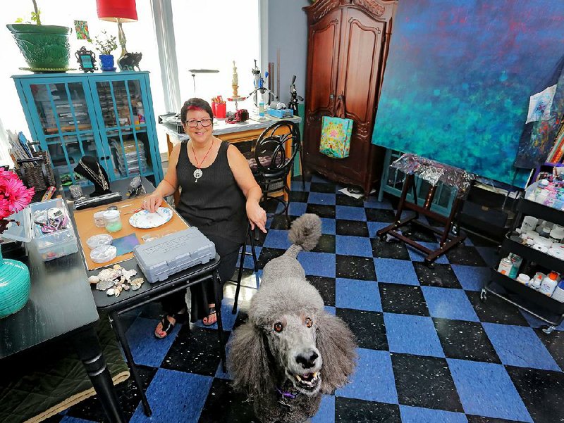 Sharon Landon, a jewelry artist. She loves her studio space.