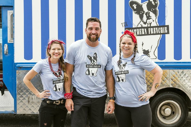 Hitting the road for The Great Food Truck Race is Little Rock chef Donnie Ferneau, his wife, Meaghan (left) and sous chef Amanda Ivy. The race begins at 8 p.m. today on Food Network.
