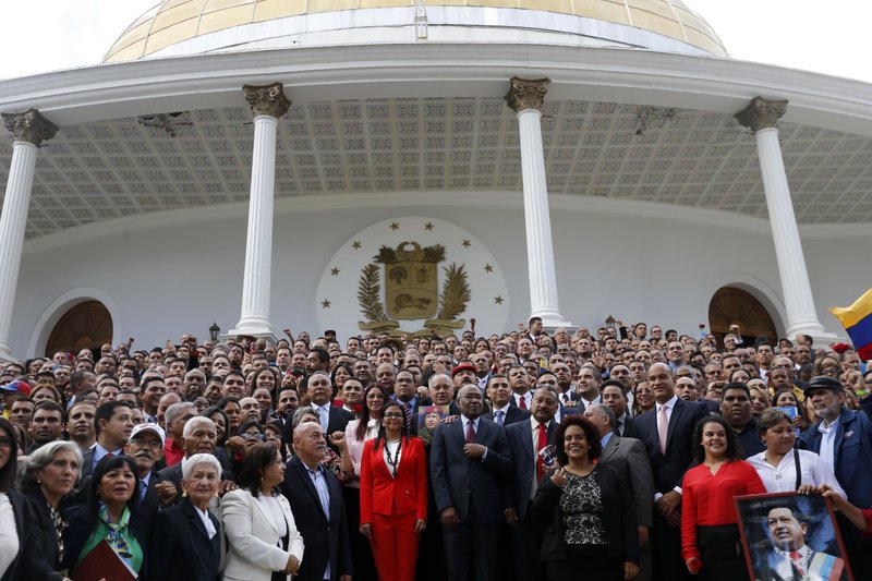 In this Aug. 4, 2017, file photo, Venezuela's Constituent Assembly poses for an official photo after being sworn in, at Venezuela's National Assembly in Caracas, Venezuela.