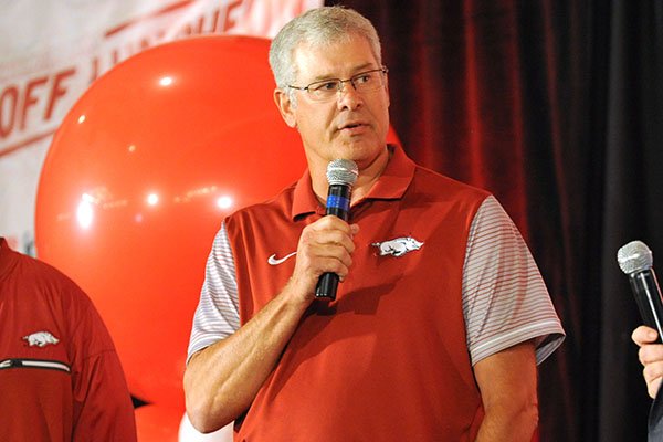 Arkansas defensive coordinator Paul Rhoads (center) answers questions Friday, Aug. 18, 2017, during the Kickoff Luncheon at the Northwest Arkansas Convention Center in Springdale.
