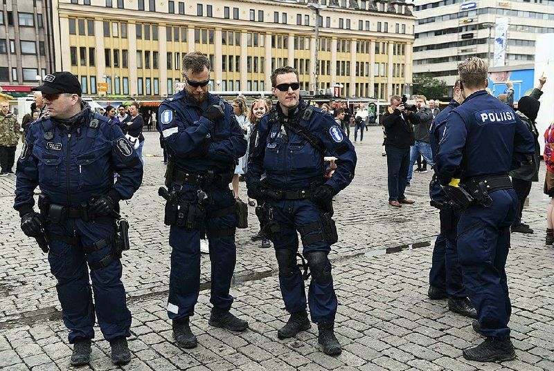 Police patrol Saturday in the market square of Turku, Finland, after Friday’s attack there.
