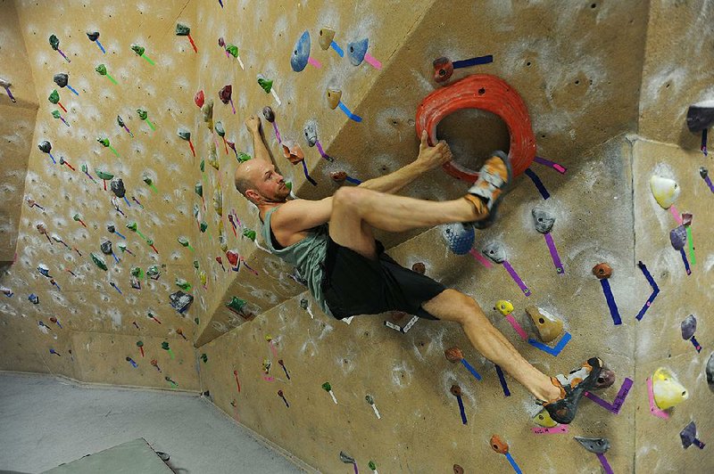 Jordan Kight of Rogers climbs Friday at Ozark Climbing Gym in Springdale. The Bentonville Planning Commission has approved the construction of a similar facility as part of the city’s efforts to expand its recreational opportunities in hopes of drawing more visitors to the area.