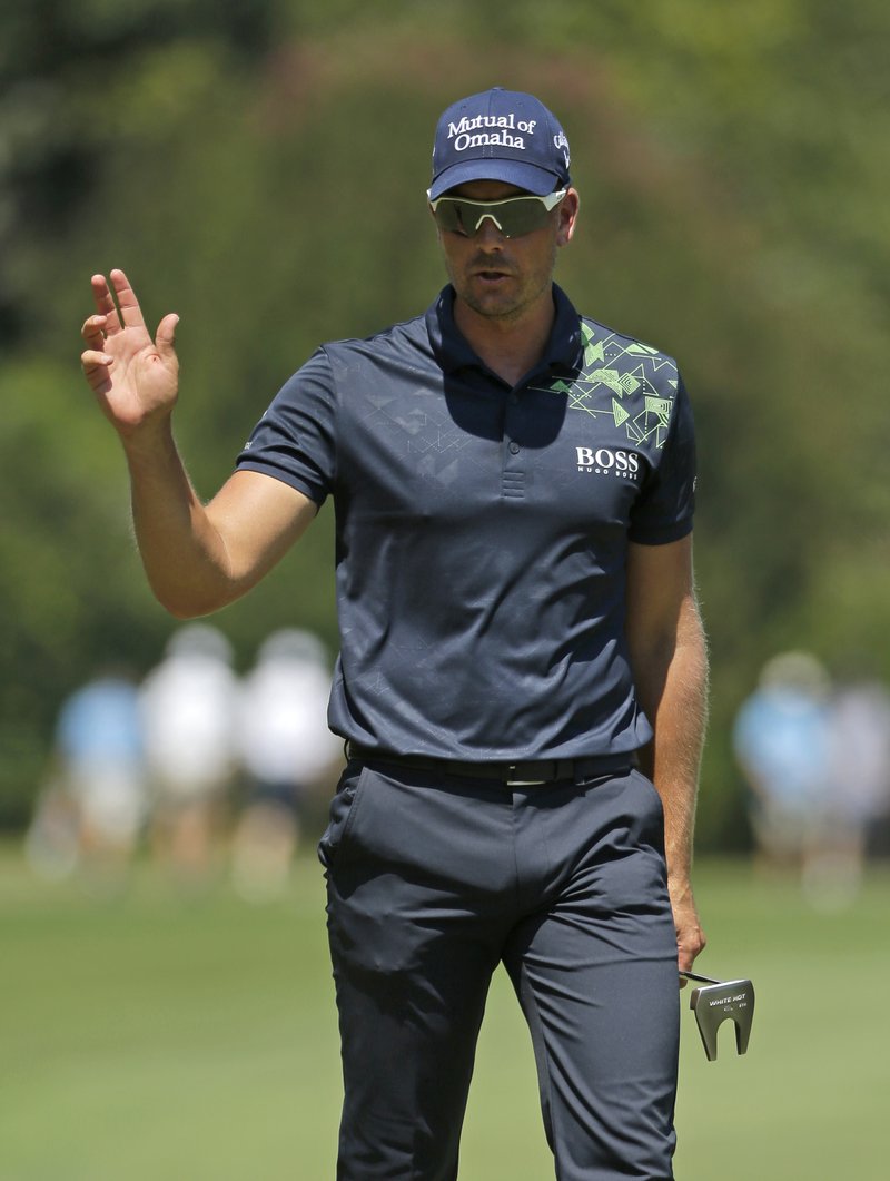 Henrik Stenson reacts to making a birdie putt on the first hole during the final round of the Wyndham Championship golf tournament in Greensboro, N.C., Sunday, Aug. 20, 2017. 