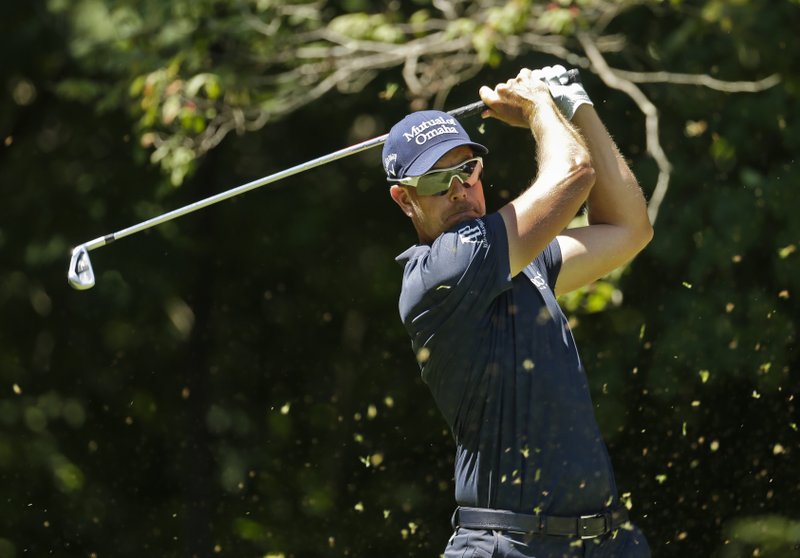 The Associated Press TEEING OFF: Henrik Stenson watches his tee shot on the second hole during the final round of the Wyndham Championship in Greensboro, N.C., Sunday. Stenson shot a 64 Sunday to claim a one-stroke victory in the final PGA Tour event of the season.