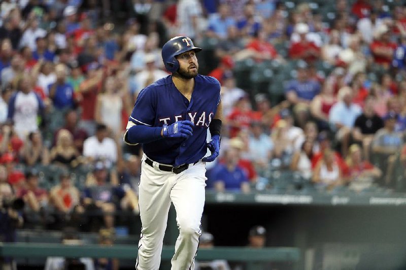 Texas Rangers' Joey Gallo watches his solo home run in the third inning of a baseball game against the Miami Marlins on Tuesday, July 25, 2017, in Arlington, Texas. 