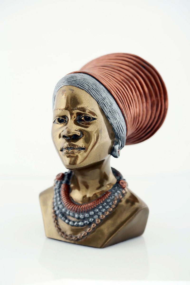 President Nelson Mandela of South Africa gave this metal bust of a woman in a traditional headdress to President Bill Clinton in 1997. The bust is one of the centerpieces of the Clinton Presidential Center’s “Art of Africa.” 