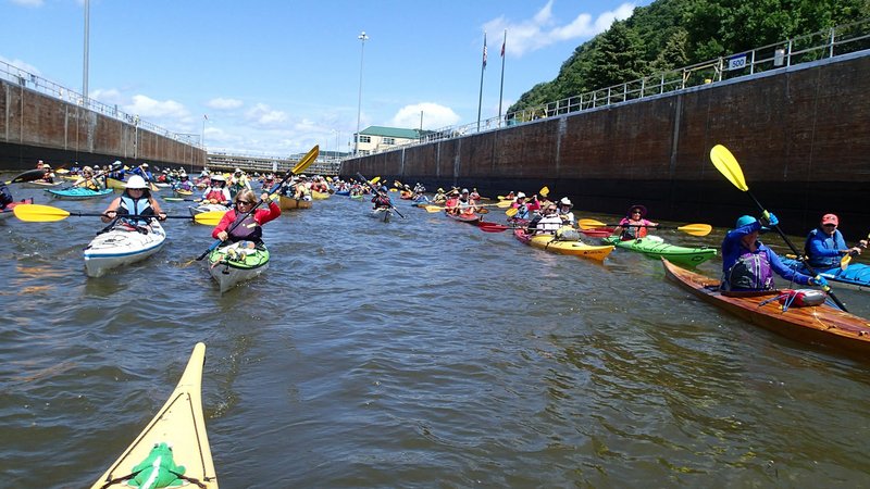 Paddlers exit a lock Aug. 4 after locking through Lock and Dam No. 9 on the Mississippi River near Harper’s Ferry, Iowa.